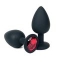 Анальная пробка черный силикон с красным кристаллом, M 